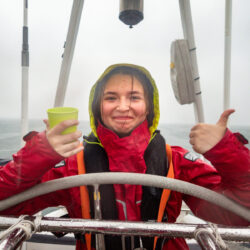 Young person at helm