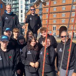 young people in Ipswich two are wearing navy caps with cape horners logo on