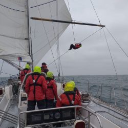 climbing spinnaker pole in wet weather