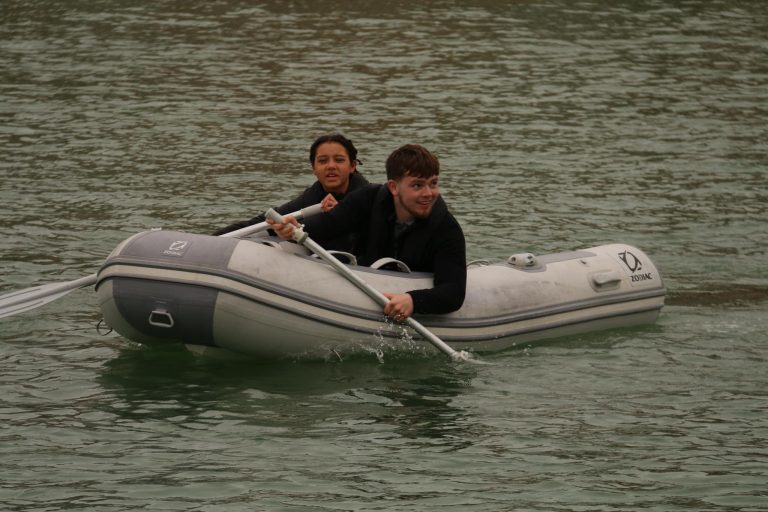 two young people in dinghy