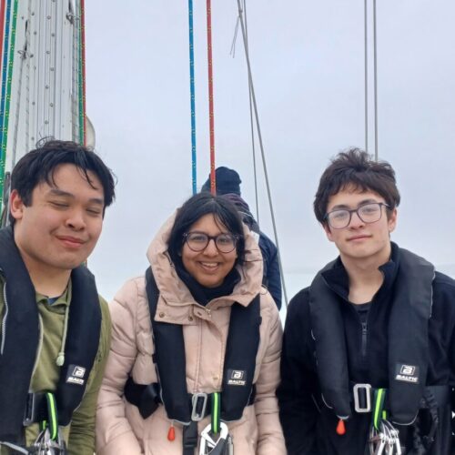 three young people posing for photo