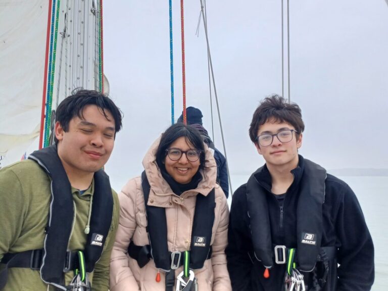 three young people posing for photo