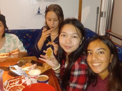 Young 12-15 years old sailing on a 72 foot challenger yacht