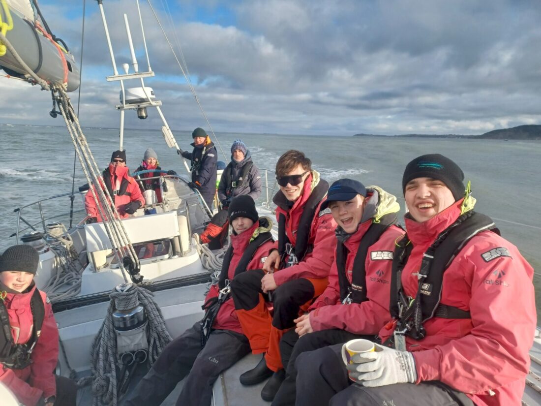A group of young people on a sailing voyage in autumn